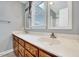 Bathroom features a double sink vanity, light gray walls, and windows that allow natural light to brighten the space at 1433 Andersonwood Dr, Fuquay Varina, NC 27526