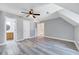 Large open bedroom with modern ceiling fan, gray walls and luxury vinyl plank floors at 1433 Andersonwood Dr, Fuquay Varina, NC 27526