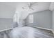 Bedroom with angled ceilings, two windows and modern gray vinyl floors offers a clean and contemporary feel at 1433 Andersonwood Dr, Fuquay Varina, NC 27526