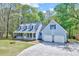Beautiful two-story house with blue siding, dormer windows, and a well-maintained lawn at 1433 Andersonwood Dr, Fuquay Varina, NC 27526