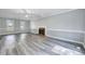 Bright living room with a fireplace and ample natural light from two windows at 1433 Andersonwood Dr, Fuquay Varina, NC 27526