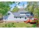 Lovely back of house with a bay window, well-maintained lawn, and a stained back deck at 1433 Andersonwood Dr, Fuquay Varina, NC 27526