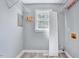 Functional utility room featuring a window and storage space at 1433 Andersonwood Dr, Fuquay Varina, NC 27526