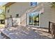 Wooden deck features sliding glass doors and outdoor lighting for evening enjoyment at 1517 Laughridge Dr, Cary, NC 27511