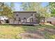 Enjoy the spacious backyard with wooden deck and mature shade trees in the neighborhood at 1517 Laughridge Dr, Cary, NC 27511