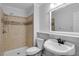 Bathroom featuring a shower with tile surround, a toilet and a sink at 1517 Laughridge Dr, Cary, NC 27511