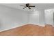 Bedroom with hardwood flooring, a ceiling fan, and closet at 1517 Laughridge Dr, Cary, NC 27511