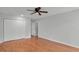 Spacious bedroom with hardwood flooring, a ceiling fan, and closet at 1517 Laughridge Dr, Cary, NC 27511