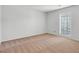 Bright bedroom features neutral paint, plush carpet, and large window for natural light at 1517 Laughridge Dr, Cary, NC 27511