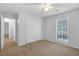 Spacious bedroom provides ample storage with a closet and abundant natural light through large window at 1517 Laughridge Dr, Cary, NC 27511