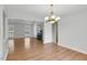 Dining area has a chandelier with fireplace and large windows at 1517 Laughridge Dr, Cary, NC 27511