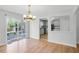 Bright dining area has a chandelier and sliding glass doors to outdoor deck at 1517 Laughridge Dr, Cary, NC 27511