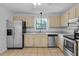 Updated kitchen featuring stainless steel appliances and ample counter space at 1517 Laughridge Dr, Cary, NC 27511