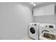 Bright laundry room featuring new washer and dryer and utility sink at 1517 Laughridge Dr, Cary, NC 27511