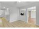 Open living room with tiled floors, with views into the entry way and dining room at 1517 Laughridge Dr, Cary, NC 27511