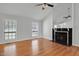 Spacious living room features a fireplace, wood floors, and natural light at 1517 Laughridge Dr, Cary, NC 27511