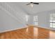 Bright living room has wood flooring, large windows, and plenty of space at 1517 Laughridge Dr, Cary, NC 27511