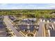 Aerial view of the community pool, clubhouse and parking lot nestled amongst neighborhood homes at 158 Sea Foam Dr, Raleigh, NC 27610