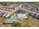 Birds eye view of a community pool and amenity center surrounded by neighborhood homes at 158 Sea Foam Dr, Raleigh, NC 27610