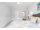 A cozy bedroom featuring a comfortable bed with floral-patterned comforter and a ceiling fan at 158 Sea Foam Dr, Raleigh, NC 27610