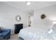 Cozy bedroom featuring a quaint mirror and floral accent wall at 158 Sea Foam Dr, Raleigh, NC 27610