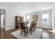 Formal dining room with wooden table, chairs, and natural lighting at 158 Sea Foam Dr, Raleigh, NC 27610