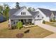 Charming home features a two-car garage, stone accents, covered porch and manicured landscaping at 158 Sea Foam Dr, Raleigh, NC 27610