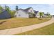 Side view of a charming home showcasing its well-maintained lawn and suburban street at 158 Sea Foam Dr, Raleigh, NC 27610