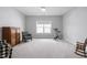 Bright flex room featuring an exercise bike and a checkered accent chair at 158 Sea Foam Dr, Raleigh, NC 27610