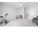 A spacious flex room with an exercise bike and comfortable seating options at 158 Sea Foam Dr, Raleigh, NC 27610