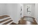 Inviting foyer featuring hardwood floors, staircase and glass front door at 158 Sea Foam Dr, Raleigh, NC 27610