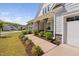 Charming covered front porch with craftsman-style columns and beautifully landscaped walkway at 158 Sea Foam Dr, Raleigh, NC 27610