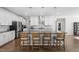 Bright kitchen with stainless appliances, island, and barstool seating at 158 Sea Foam Dr, Raleigh, NC 27610