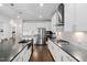 Spacious kitchen with a large island, stainless appliances, and white cabinetry at 158 Sea Foam Dr, Raleigh, NC 27610
