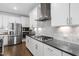 Modern kitchen featuring stainless steel appliances, gas range, and gray marble backsplash at 158 Sea Foam Dr, Raleigh, NC 27610