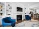 Cozy living room features a fireplace, custom built-ins, and hardwood floors at 158 Sea Foam Dr, Raleigh, NC 27610