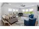 Spacious living room with comfortable seating, piano, and bright natural light at 158 Sea Foam Dr, Raleigh, NC 27610