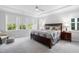 Spacious bedroom featuring tray ceilings, neutral colors, and ample natural light at 158 Sea Foam Dr, Raleigh, NC 27610