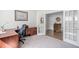 Comfortable office with french doors, stylish desk and chair, and serene decor at 158 Sea Foam Dr, Raleigh, NC 27610