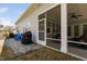 Cozy screened-in porch with views, grill, Adirondack chairs, and direct access to backyard at 158 Sea Foam Dr, Raleigh, NC 27610