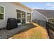 Cozy screened-in porch with a grill, access to a screened-in area, and backyard views at 158 Sea Foam Dr, Raleigh, NC 27610