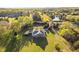 Scenic aerial view of the property with a house, pond, and lush greenery at 1601 Dairyland Rd, Chapel Hill, NC 27516