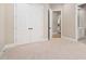 Spacious room featuring neutral carpet, a closet, and an open doorway leading to the en-suite bathroom at 1601 Dairyland Rd, Chapel Hill, NC 27516