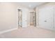 Bedroom view showcasing en-suite bathroom and double closets, offering ample storage and privacy at 1601 Dairyland Rd, Chapel Hill, NC 27516