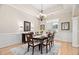 Elegant dining room featuring a tray ceiling, stylish lighting, and a refined setting for memorable meals at 1601 Dairyland Rd, Chapel Hill, NC 27516