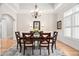 Beautiful dining room with tray ceiling, elegant lighting, and ample seating, ideal for entertaining guests at 1601 Dairyland Rd, Chapel Hill, NC 27516