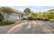 Long driveway and lush landscaping leading to a well-maintained home at 1601 Dairyland Rd, Chapel Hill, NC 27516