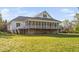 Beautiful exterior featuring a spacious screened porch and a well-maintained lawn at 1601 Dairyland Rd, Chapel Hill, NC 27516
