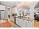 Kitchen featuring stainless appliances, granite countertops, and seamless flow to dining area at 1601 Dairyland Rd, Chapel Hill, NC 27516