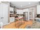 Kitchen with stainless steel appliances, granite countertops, and abundant white cabinetry at 1601 Dairyland Rd, Chapel Hill, NC 27516